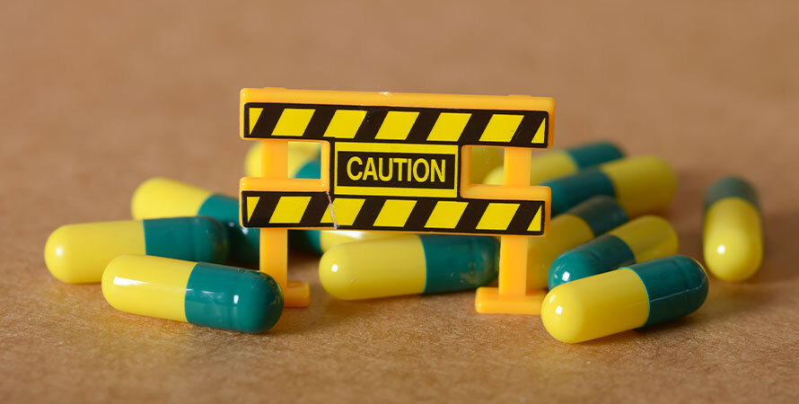 Health Warning Yellow Green Capsules Toy